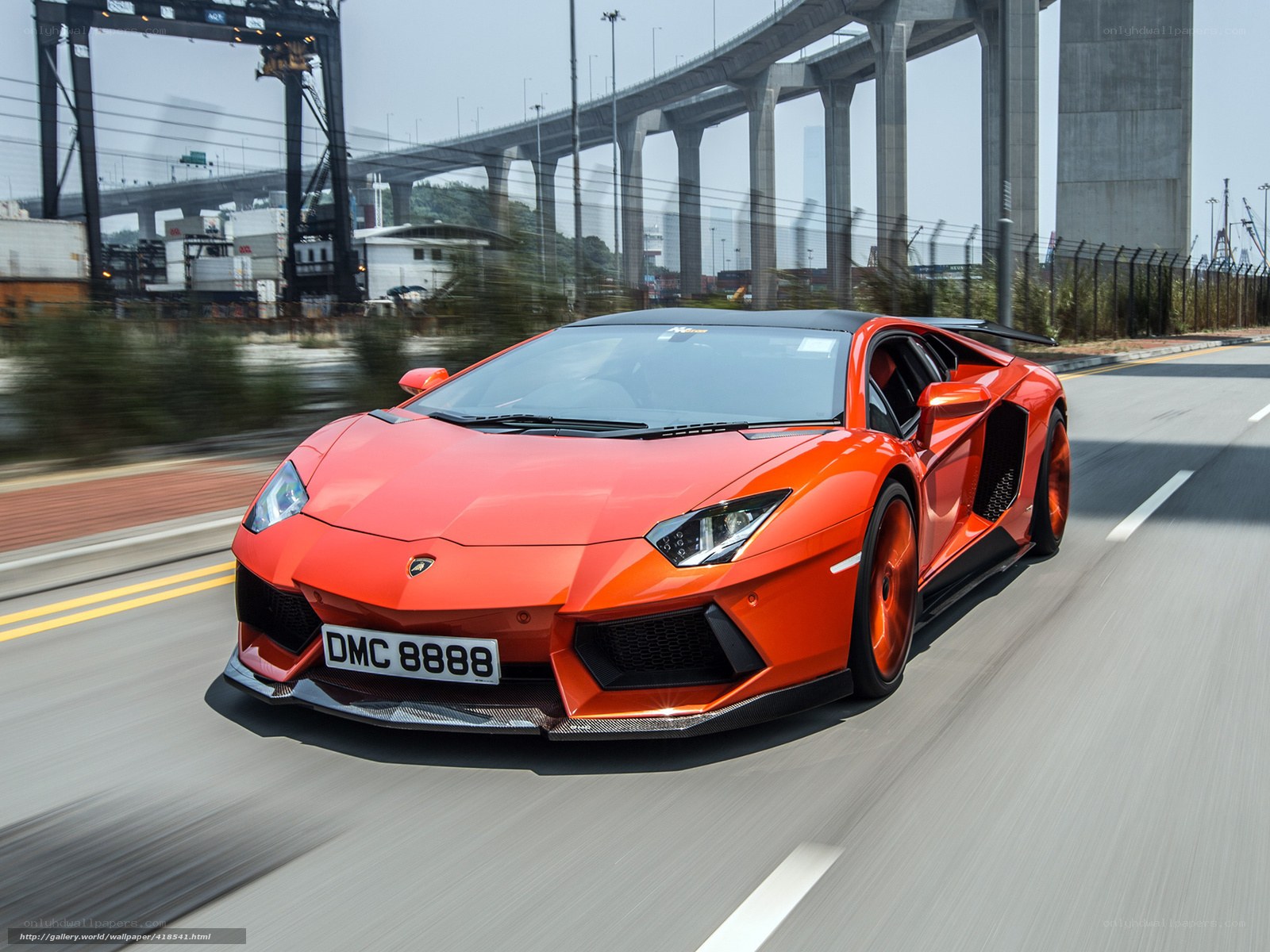 orange Lamborghini speeding on road