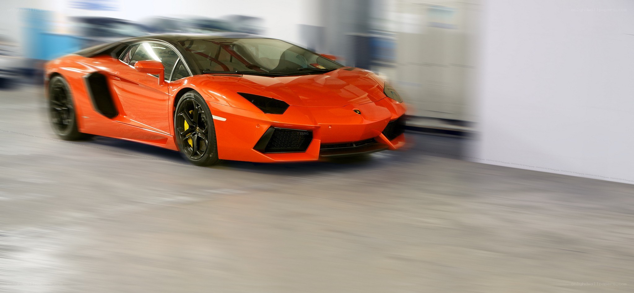 Orange Lamborghini speeding