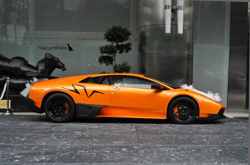 Orange Lamborghini wedding car