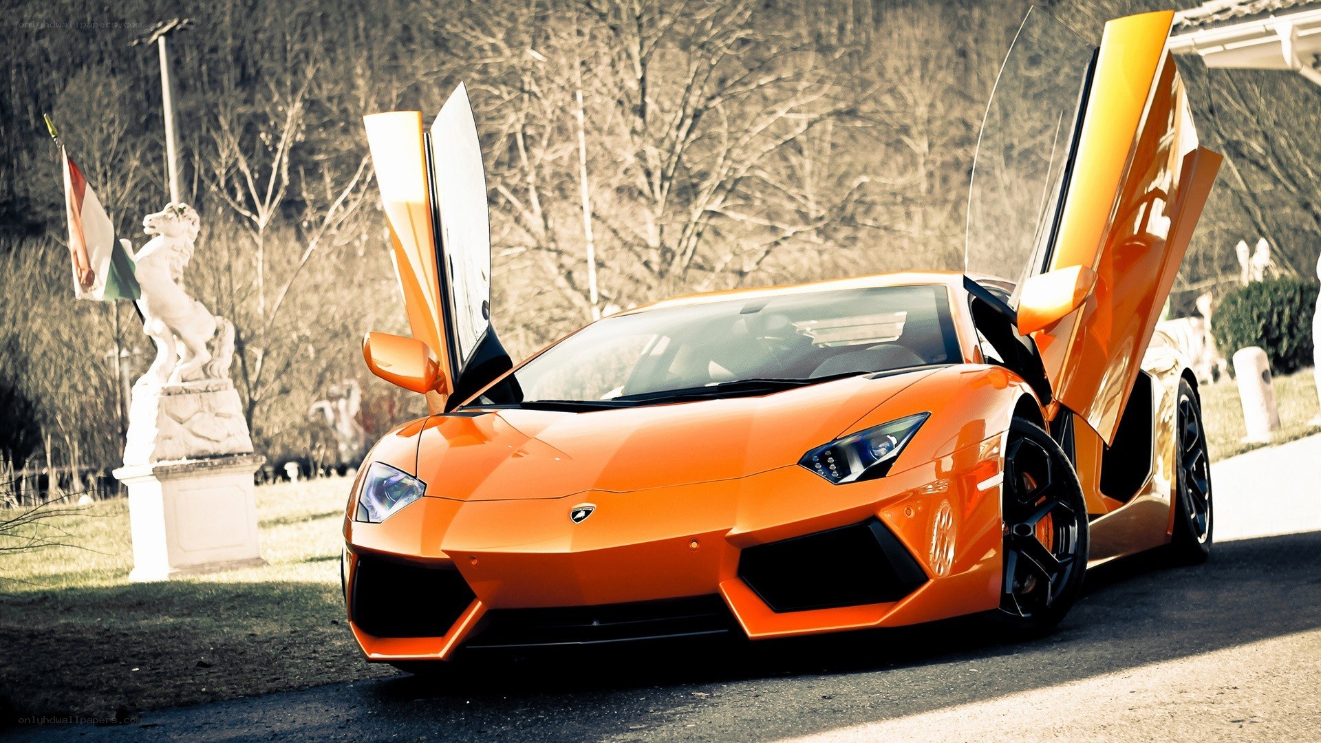 Orange Lamborghini with doors open