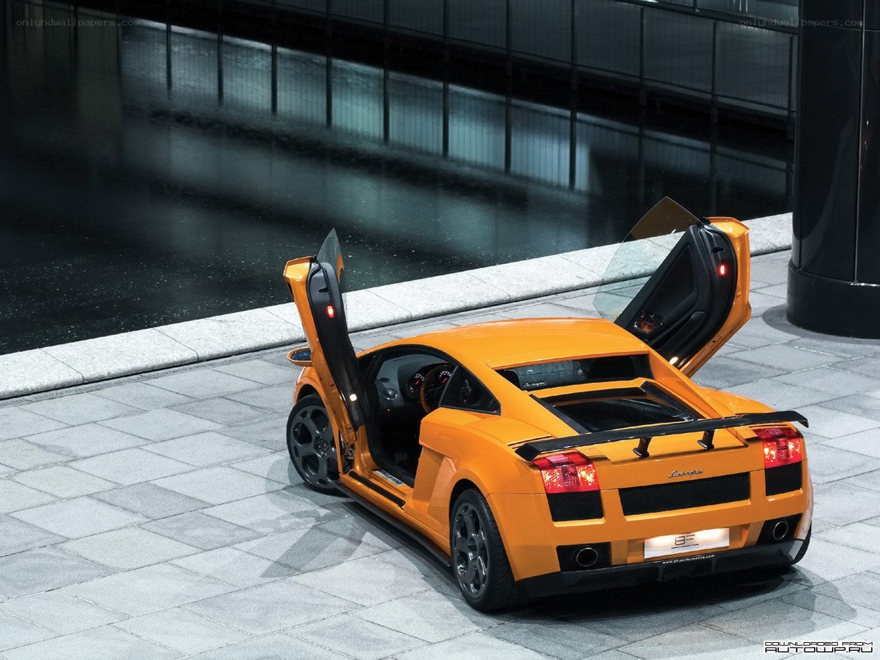 orange Lamborghini with doors open