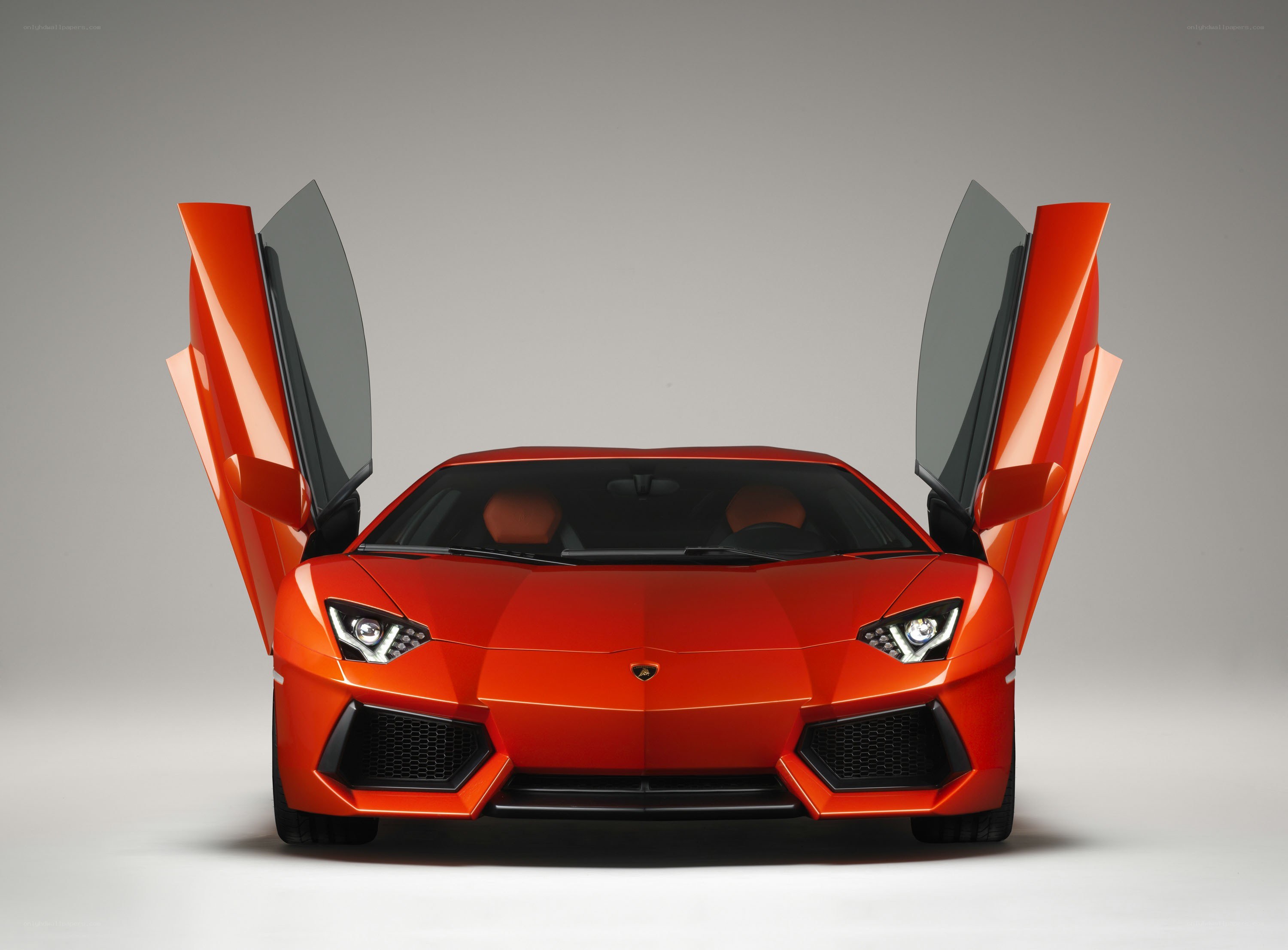 Orange Lamborghini with doors open