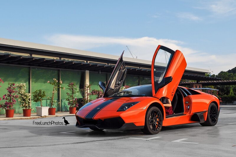 Orange Lamborghini with doors open