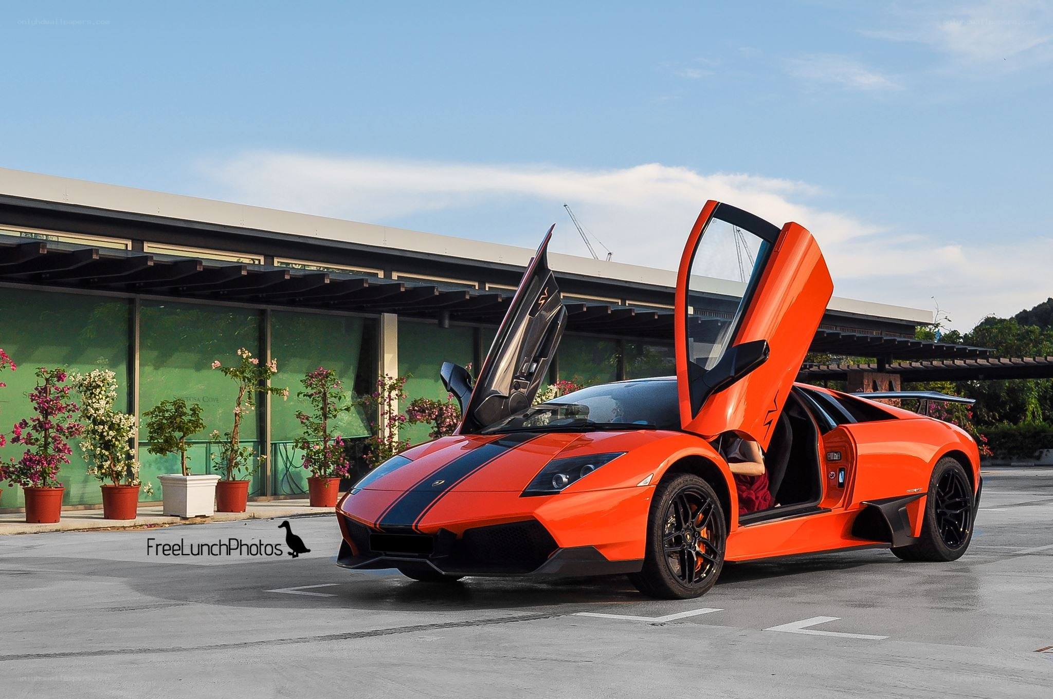 Orange Lamborghini with doors open