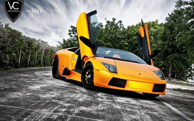 Orange Lamborghini with doors open