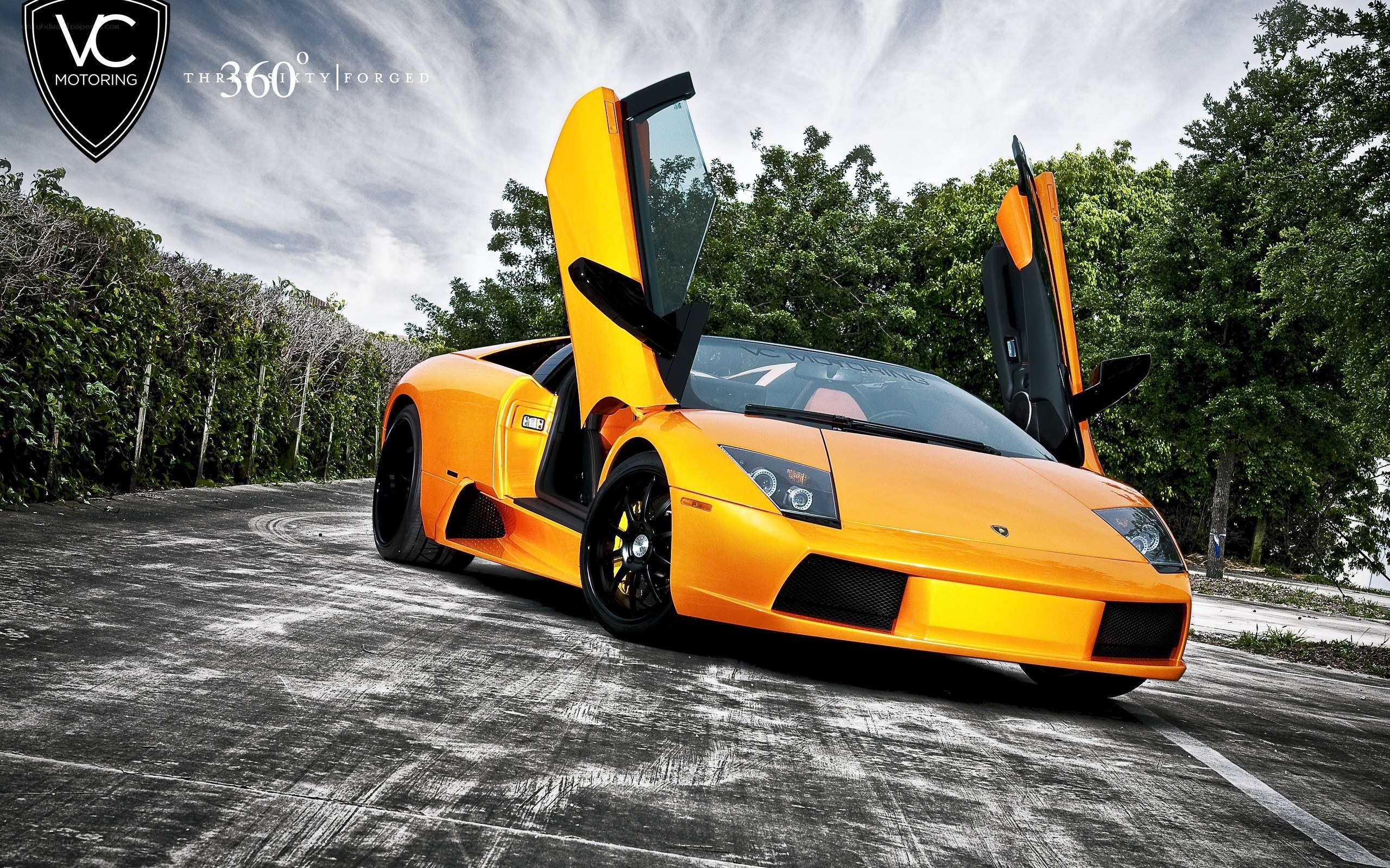Orange Lamborghini with doors open