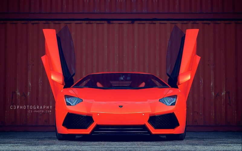 Orange Lamborghini with doors open