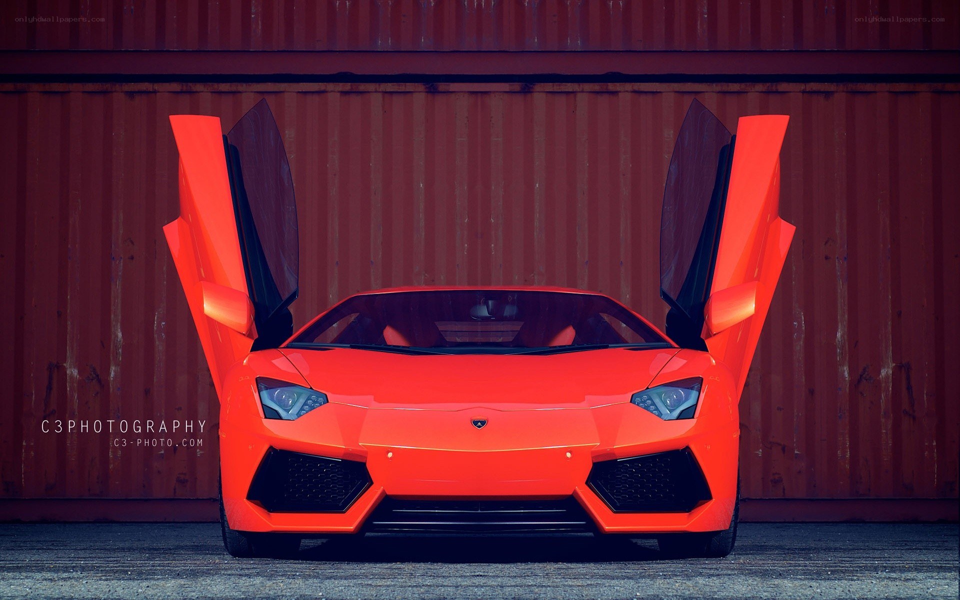 Orange Lamborghini with doors open