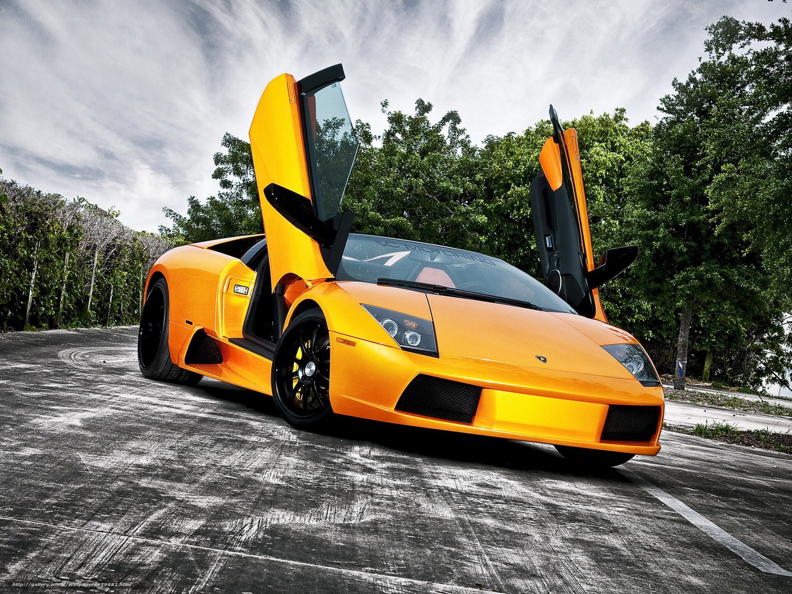 Orange Lamborghini with doors open