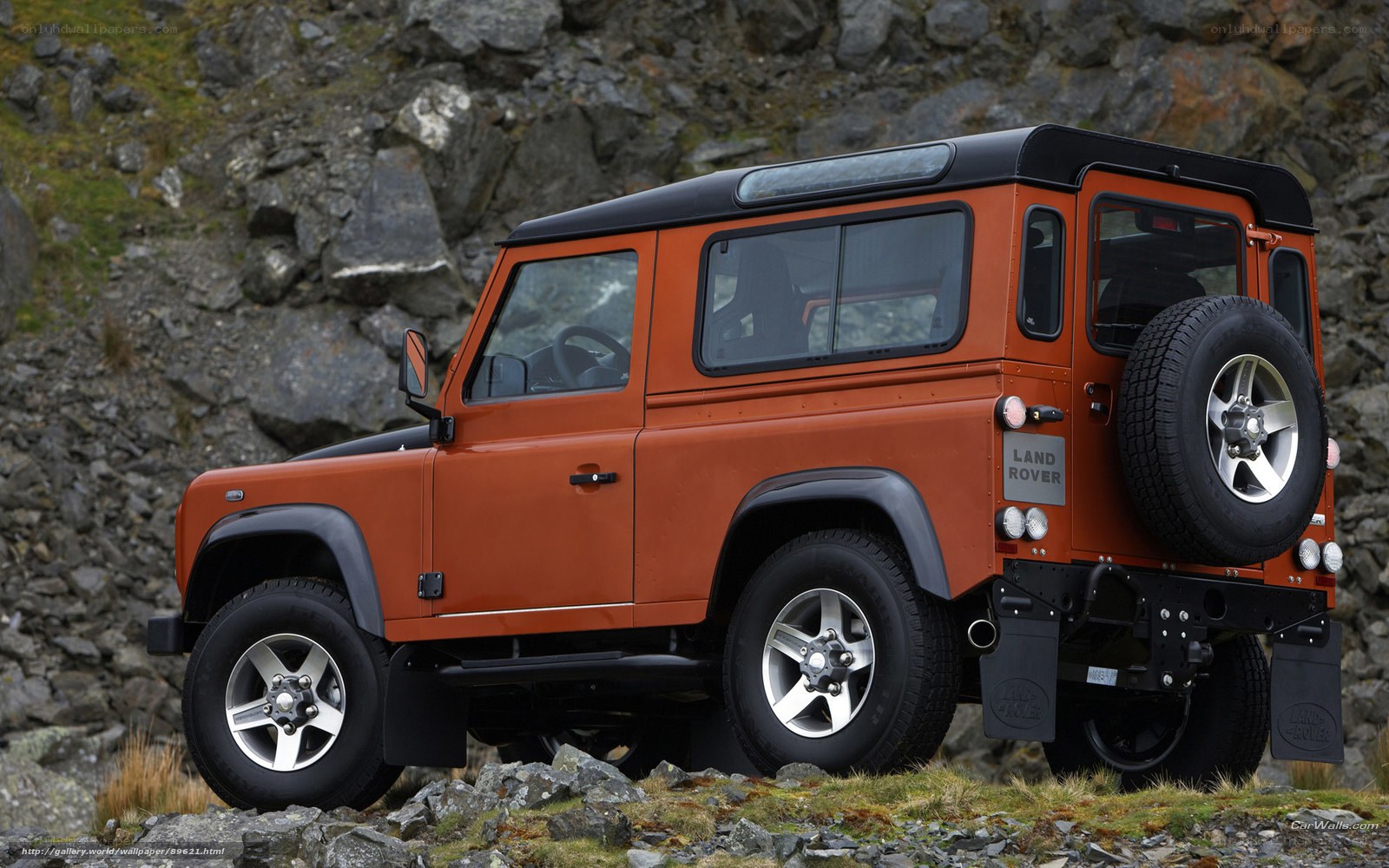 orange land rover defender