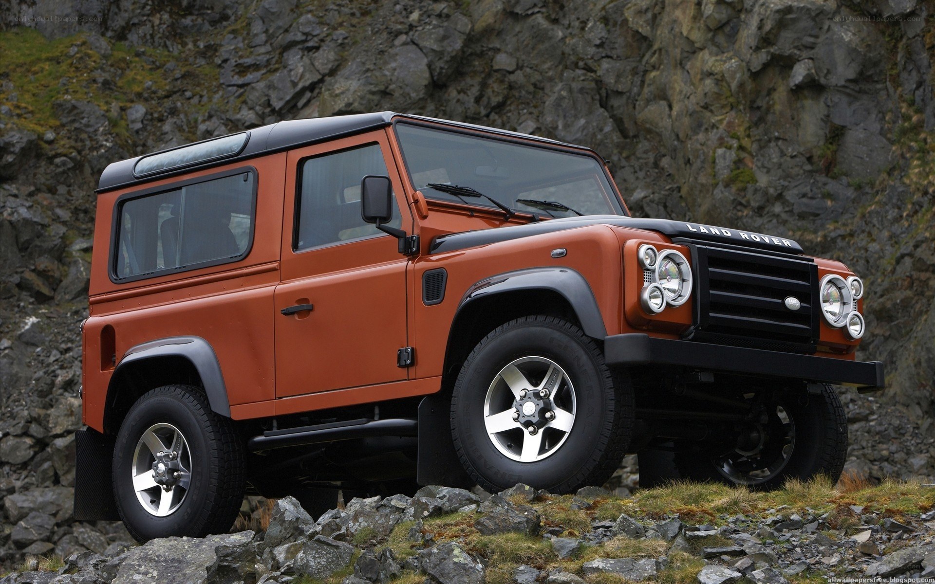 orange land rover defender