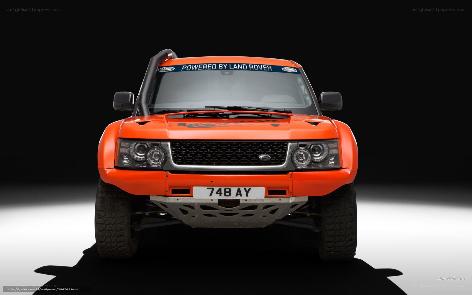 orange land rover rally car