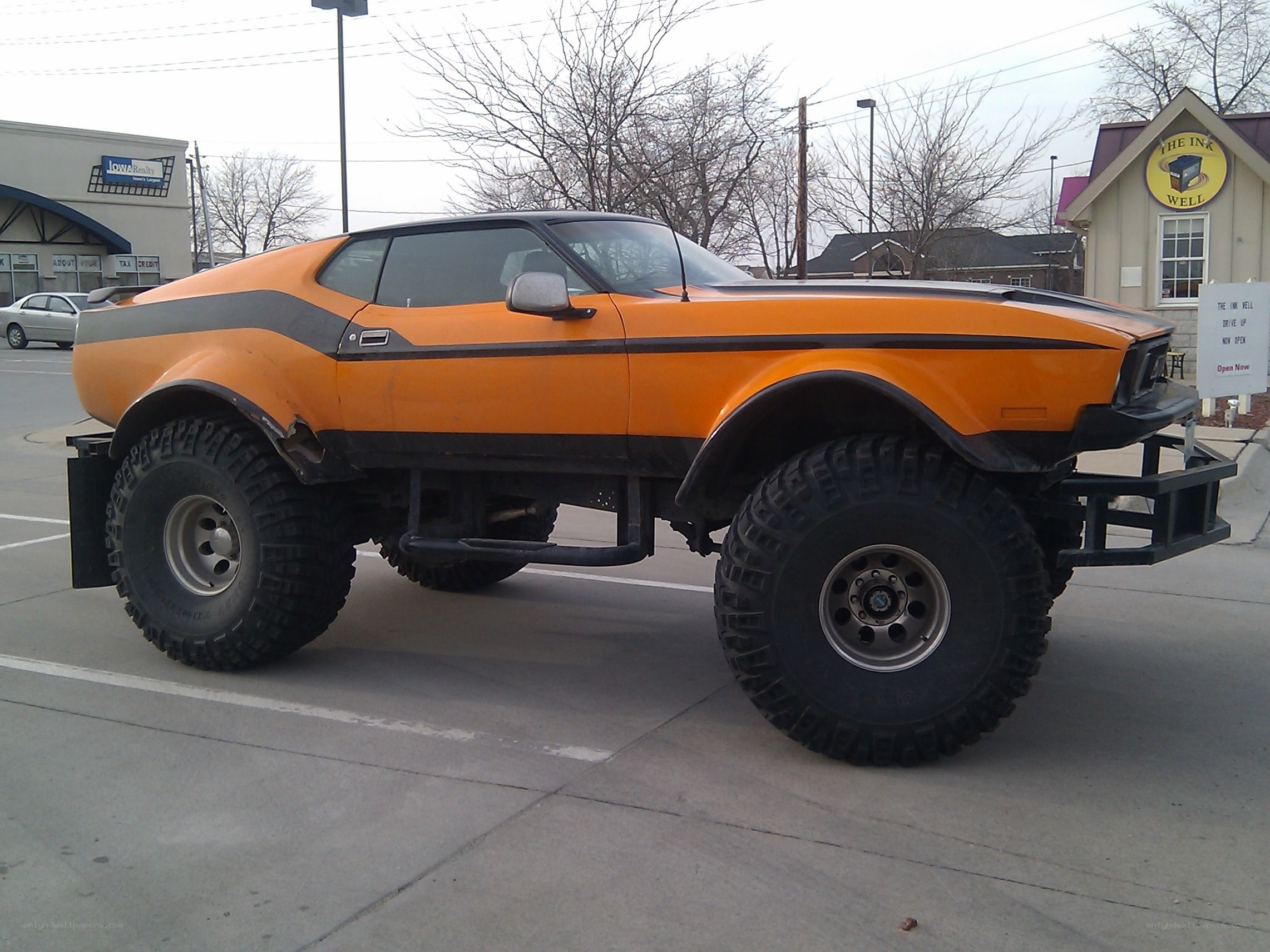 orange lifted muscle car