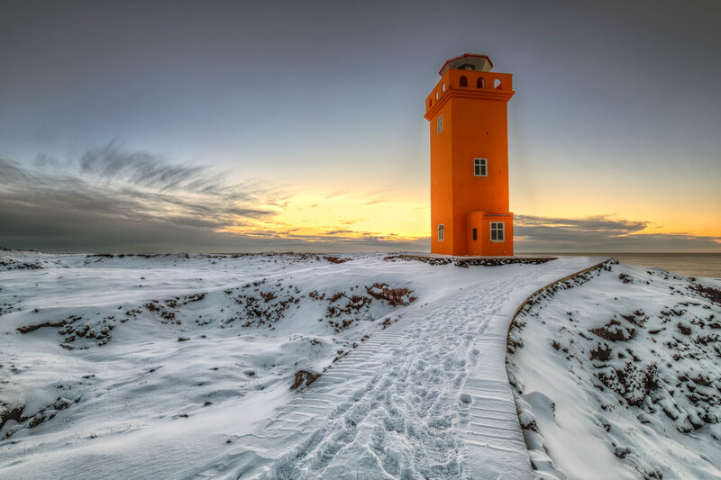 Orange Lighthouse in Snow