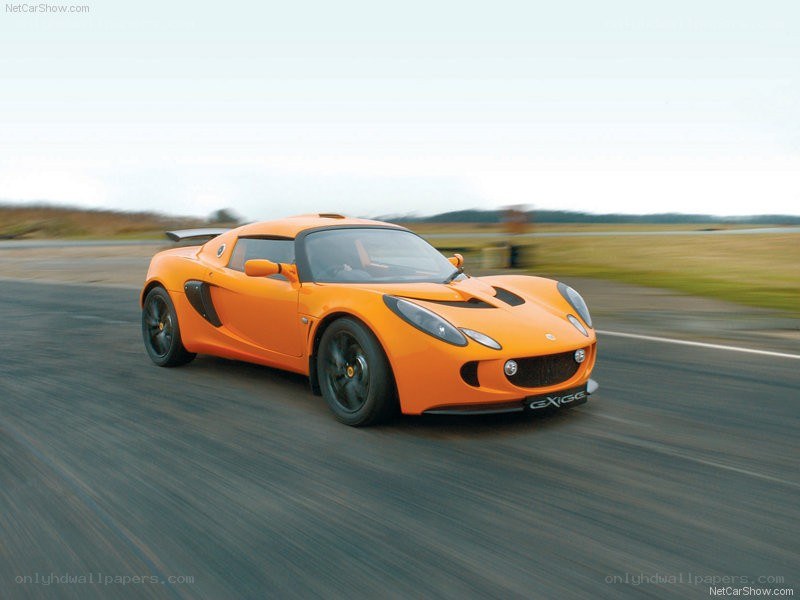 Orange Lotus Exige on a racetrack