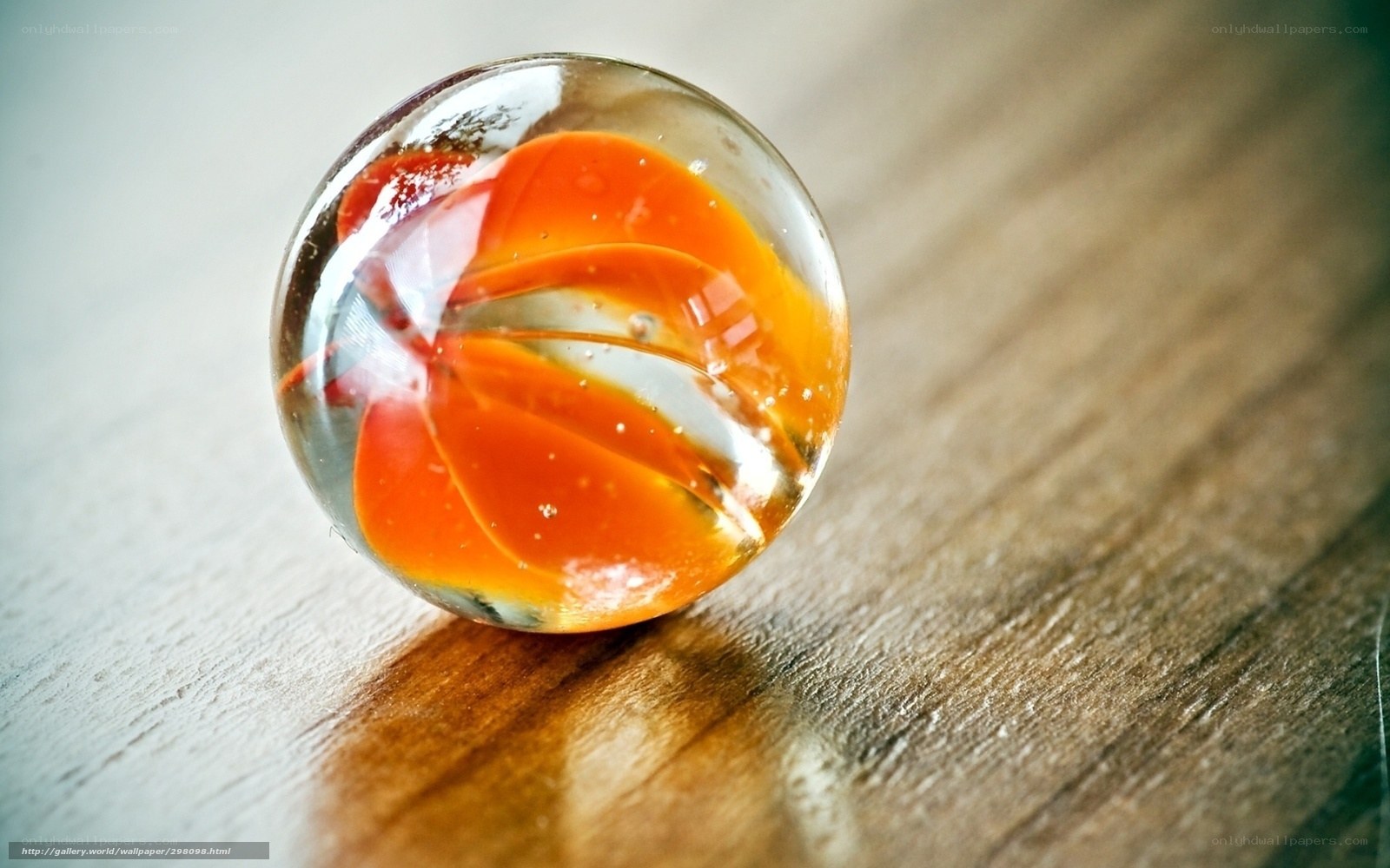 Orange marble on wood