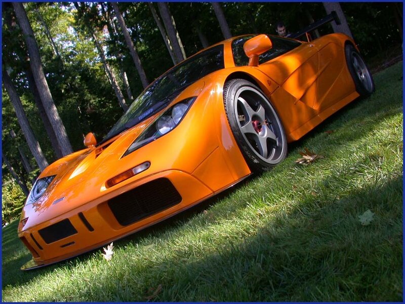 orange McLaren F1 on grass