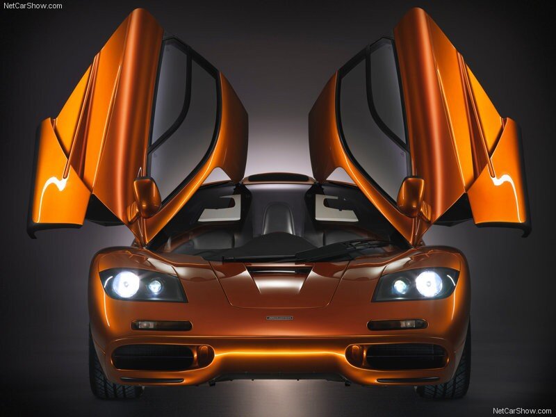 orange McLaren F1 with doors open