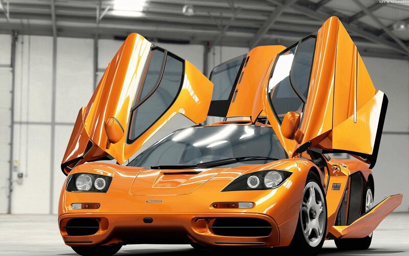 orange McLaren F1 with doors open