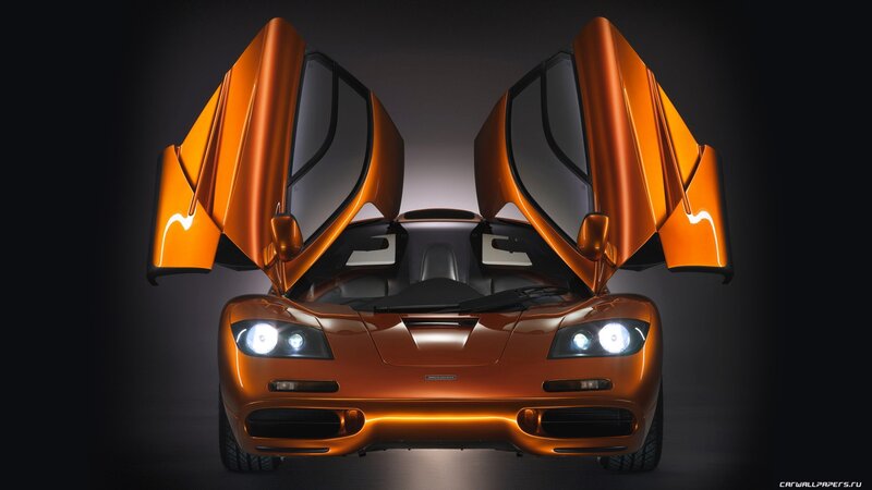 orange McLaren F1 with doors open