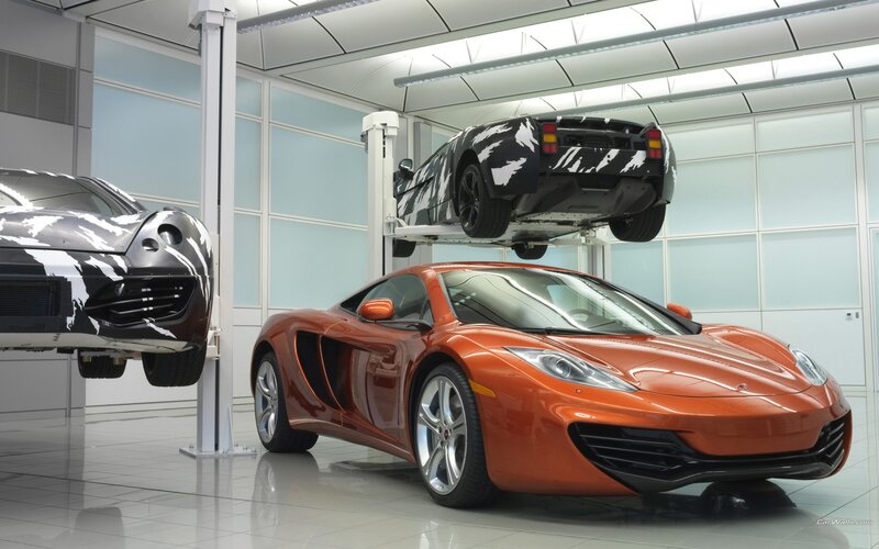 Orange McLaren in a garage
