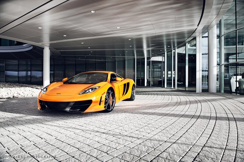 Orange McLaren in modern building