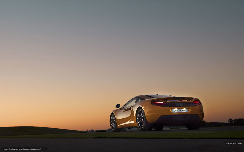 Orange McLaren MP4-12C at sunset