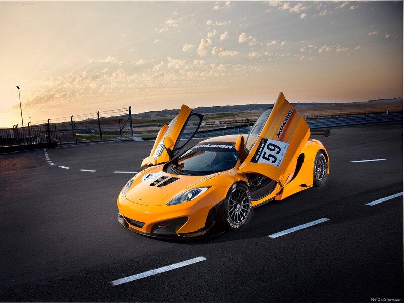 Orange McLaren MP4-12C on racetrack