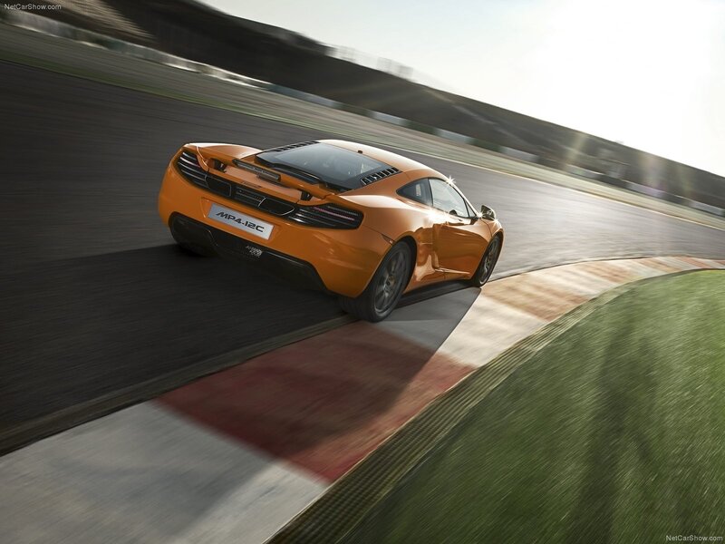 Orange McLaren MP4-12C on track