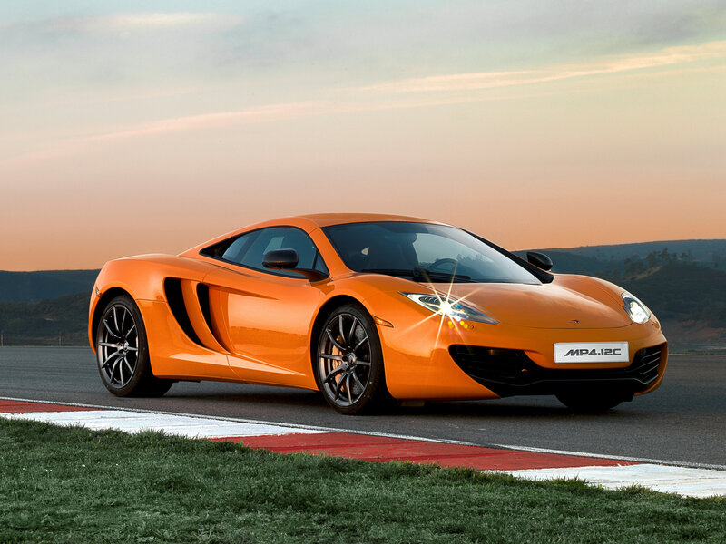 Orange McLaren MP4-12C on track