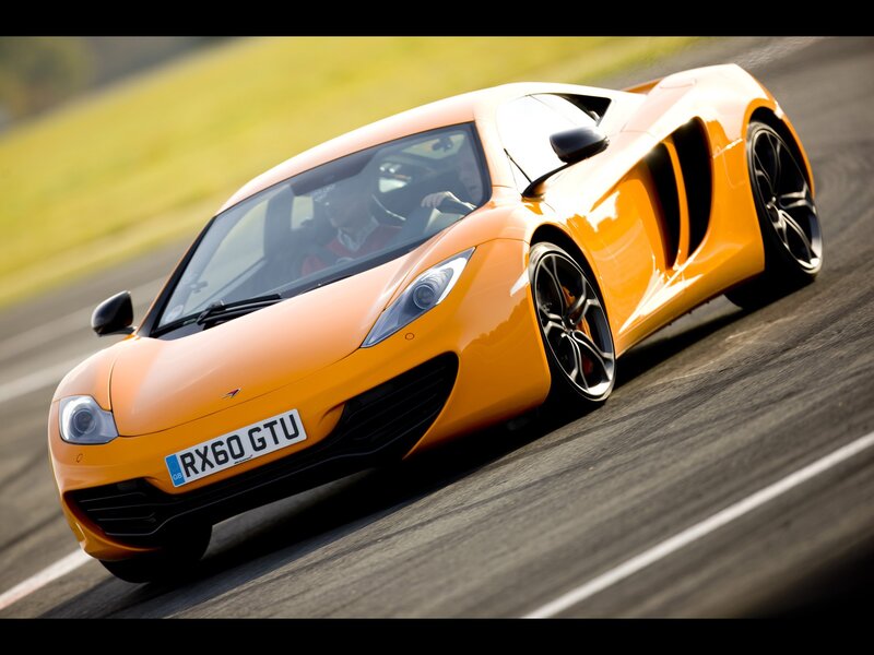 orange McLaren on a racetrack