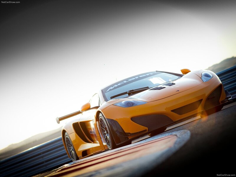 Orange McLaren on a racetrack