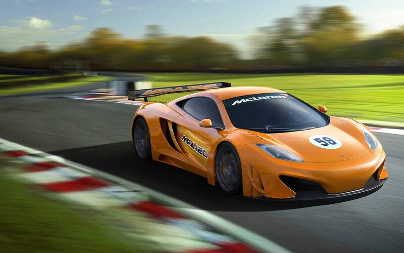 Orange McLaren on a racetrack