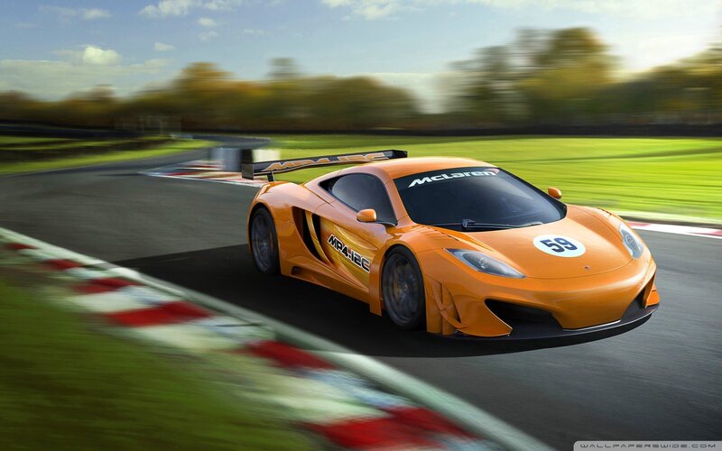 Orange McLaren on a racetrack