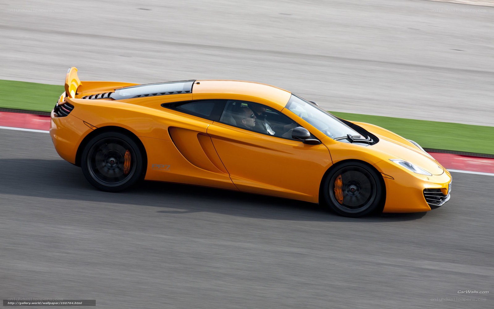 orange McLaren on a racetrack