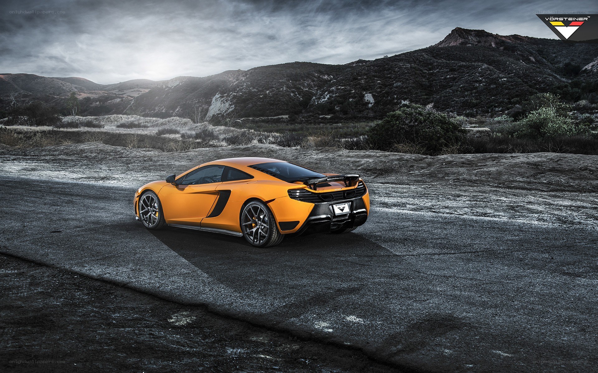 Orange McLaren on a road