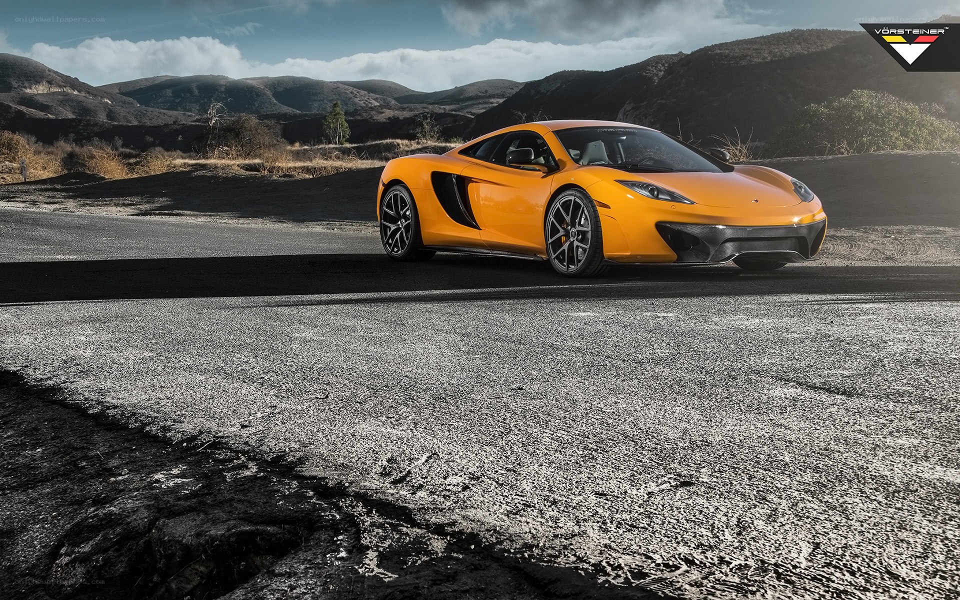 Orange McLaren on a road