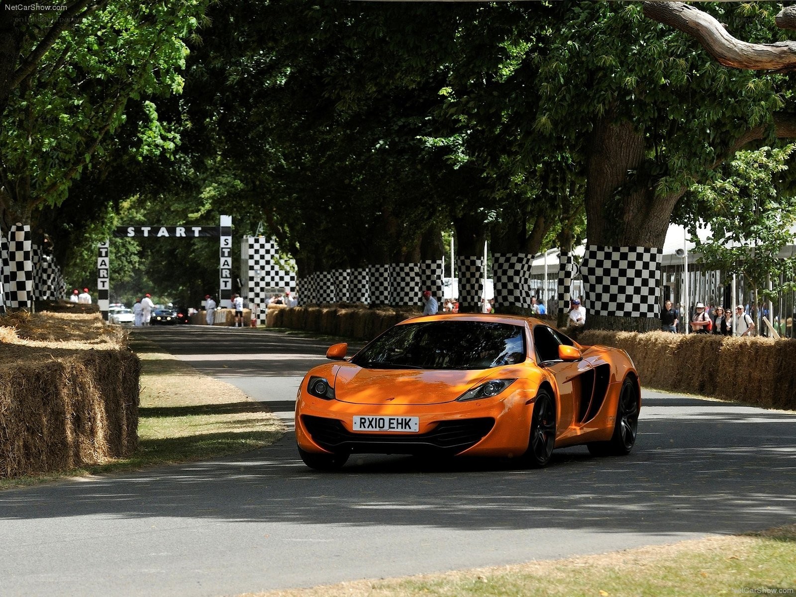 Orange McLaren on a track