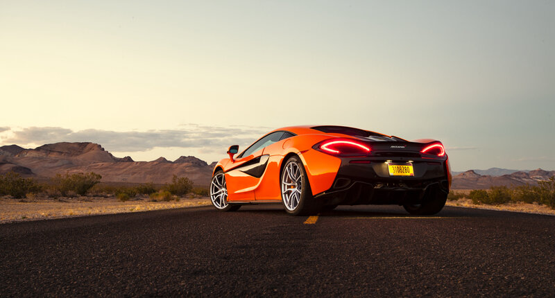 Orange McLaren on desert road