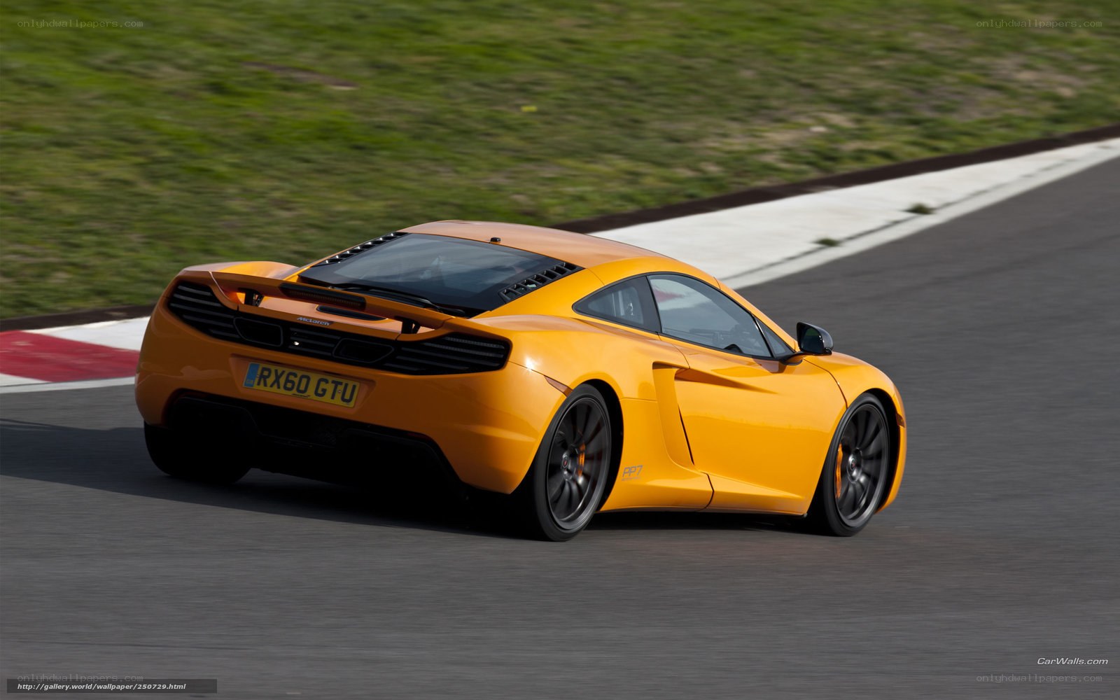 orange McLaren on racetrack