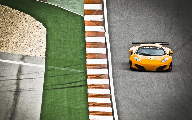 Orange McLaren on racetrack
