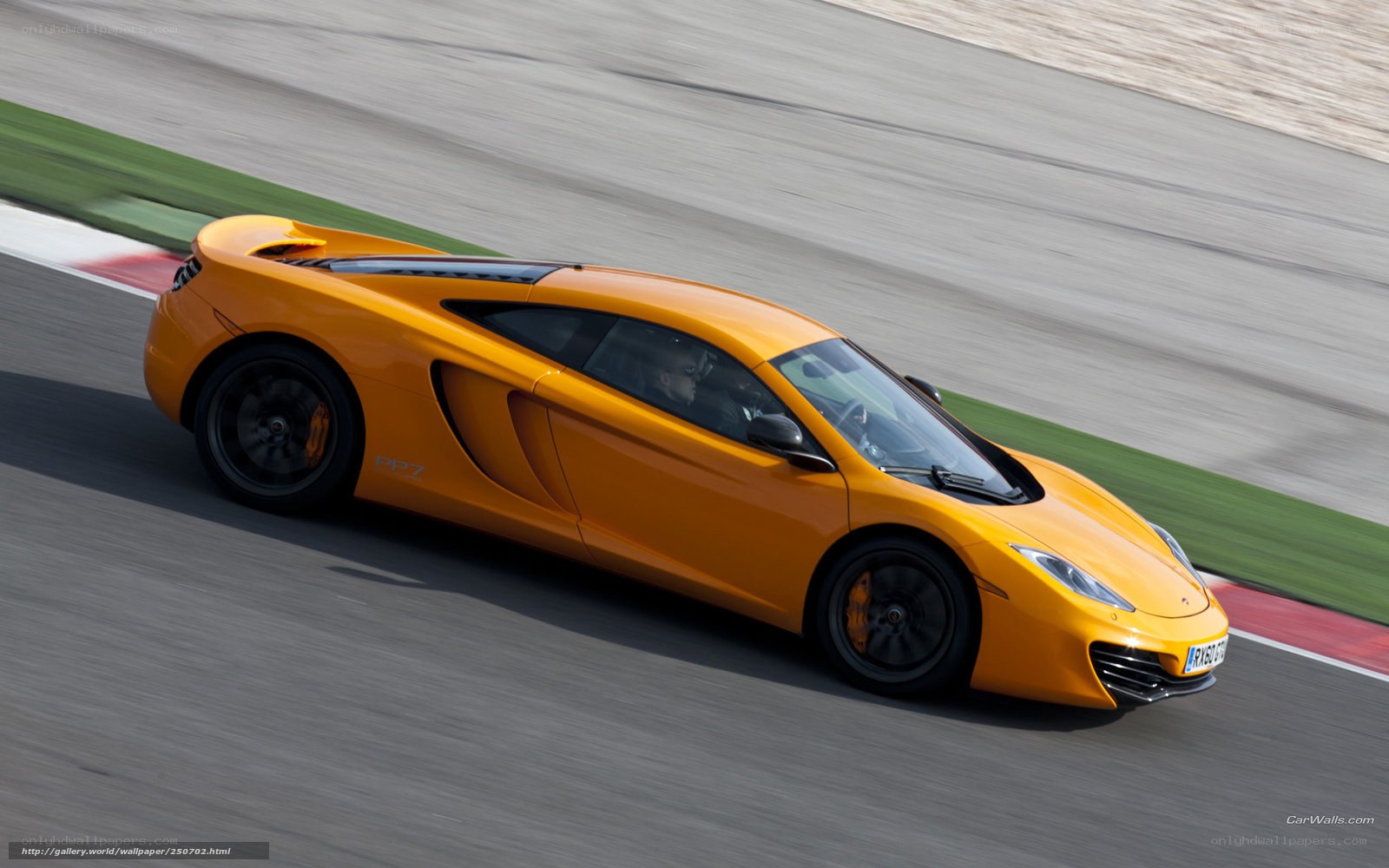 orange McLaren on racetrack