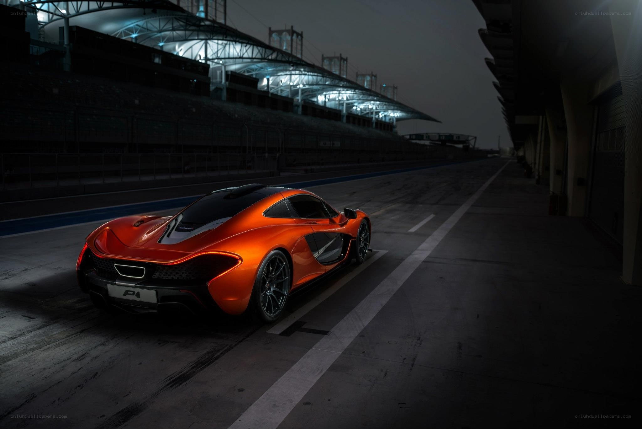 Orange McLaren P1 on a racetrack