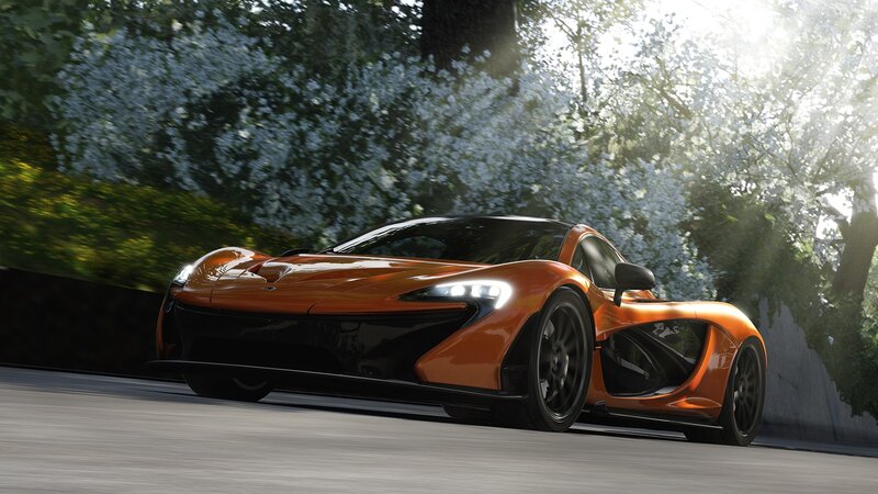 Orange McLaren P1 on a road