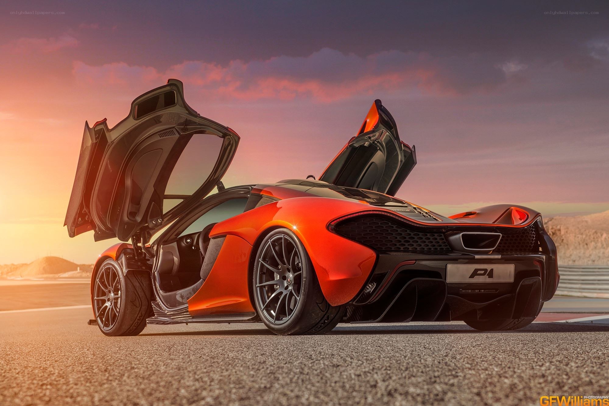 orange McLaren P1 on racetrack