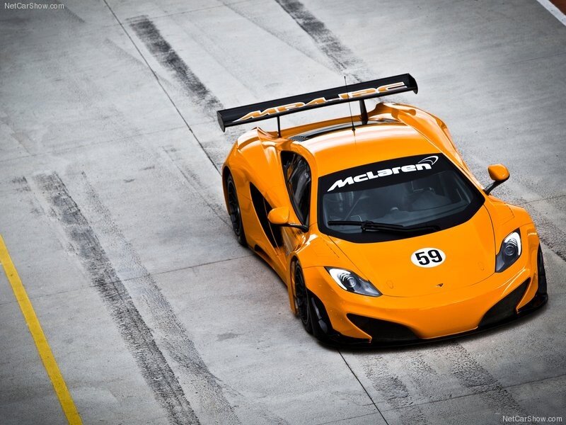 Orange McLaren race car on track