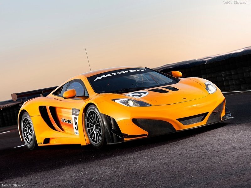 Orange McLaren race car on track