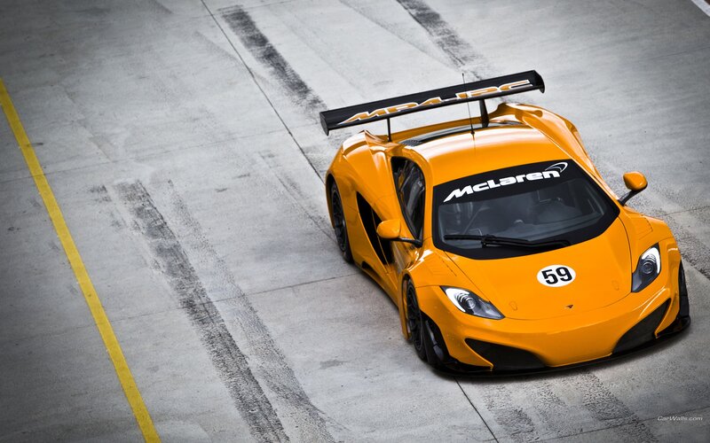 Orange McLaren race car on track