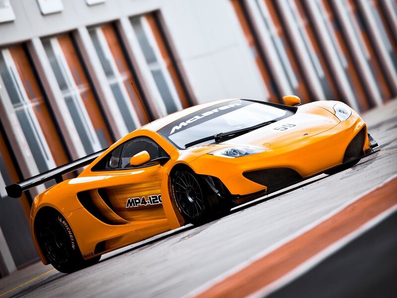 Orange McLaren race car on track