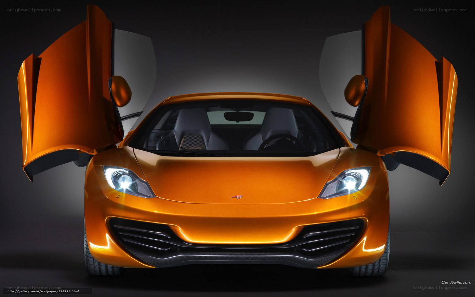 Orange McLaren with doors open